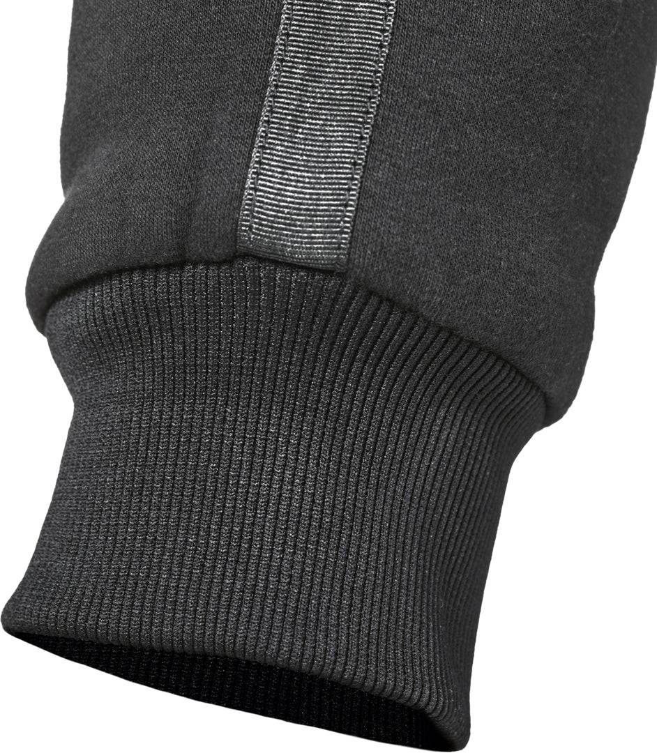 Närbild på benslutet av GMS Kevlar Mc-Mjukisbyxor Jogger Cruz Svart med ribbad mudd och reflexband för synlighet.